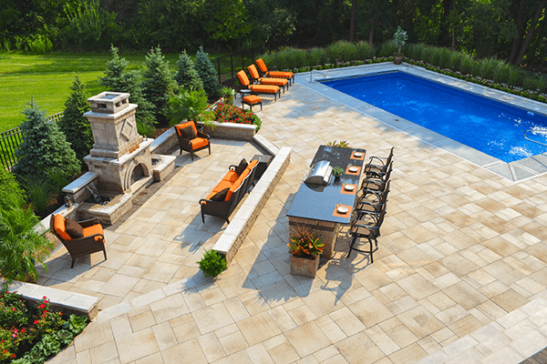 Large paver patio, fireplace and pool
