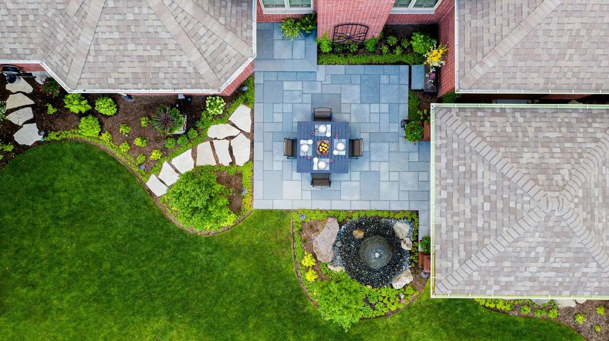 aerial photo of patio with seating area water feature and plantings