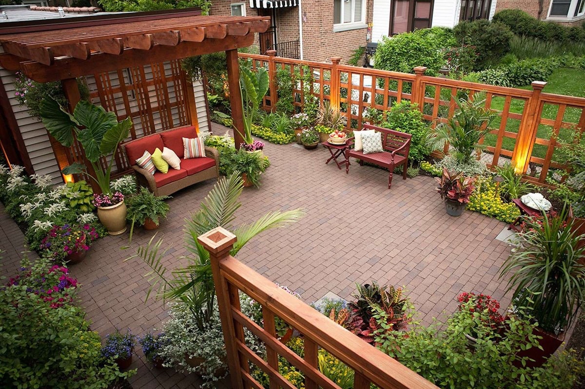brick patio with pergola and lots of plantings