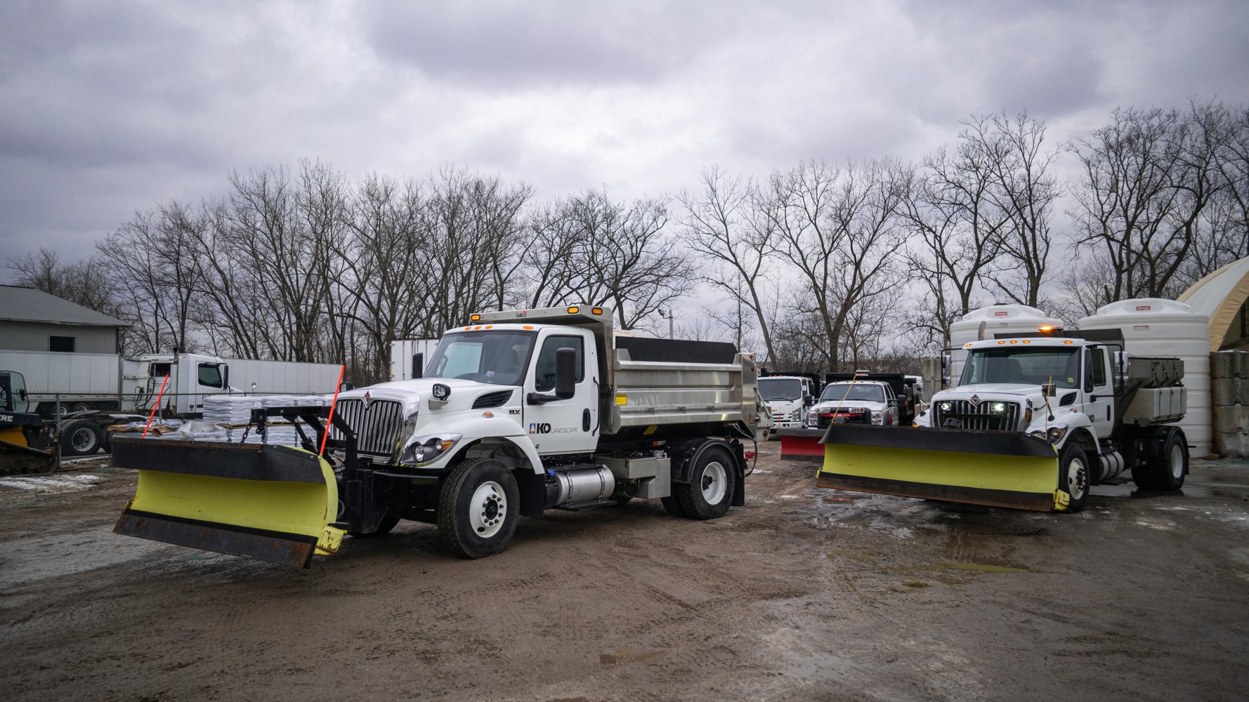 Commercial Snow Removal equipment at landscape yard preparing for a storm
