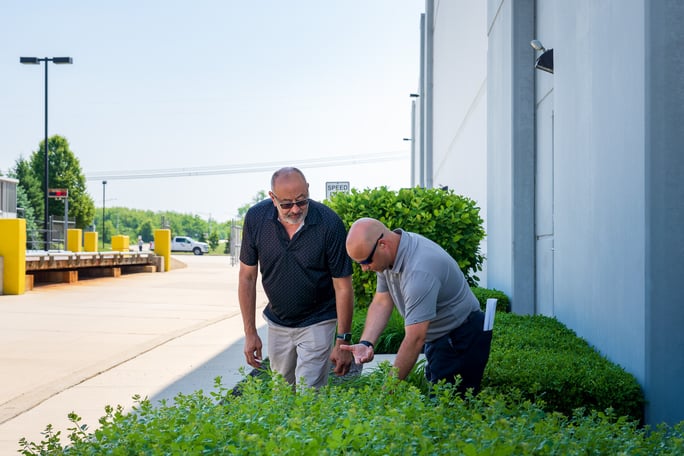 property manager and account manager inspect plants
